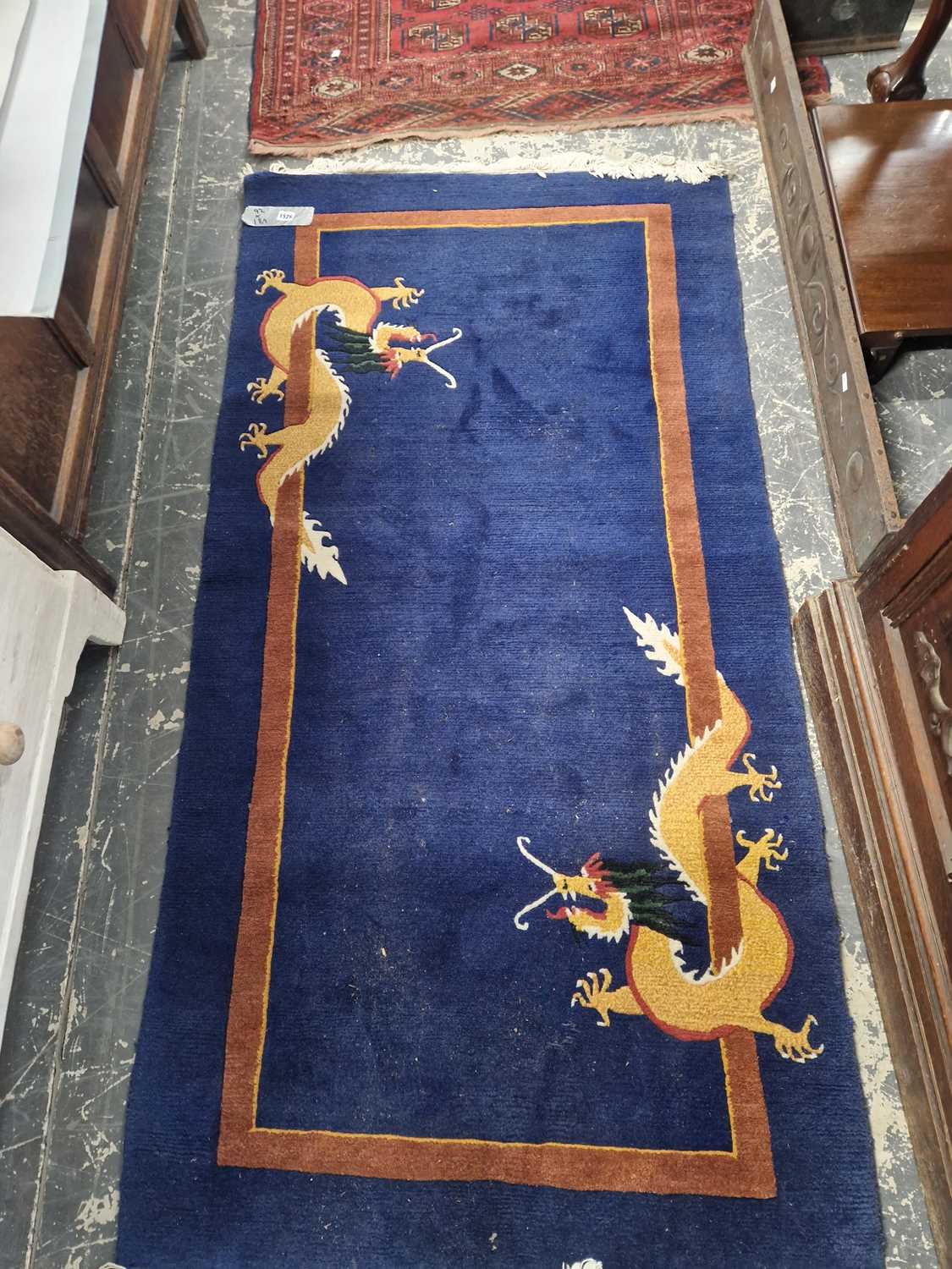Lot 1526 - A Tibetan dragon rug 189 x 92 cm