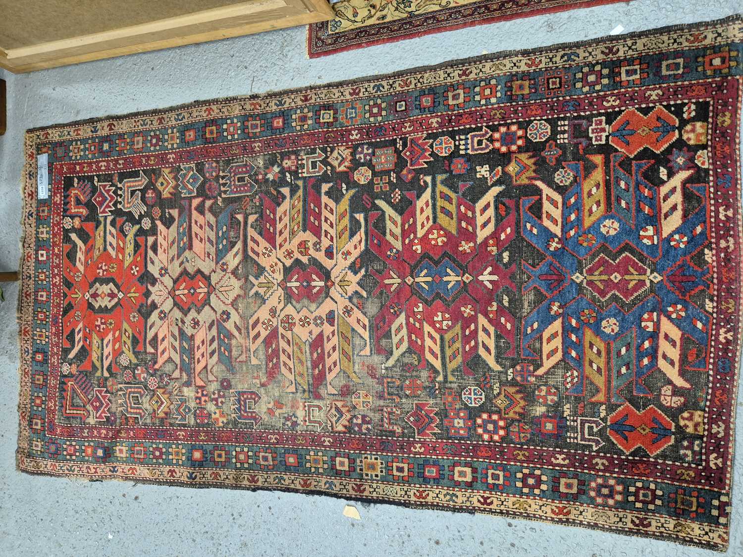 Lot 1558 - An antique Caucasian rug 211 x 121 cm
