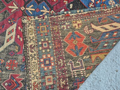 Lot 1558 - An antique Caucasian rug 211 x 121 cm