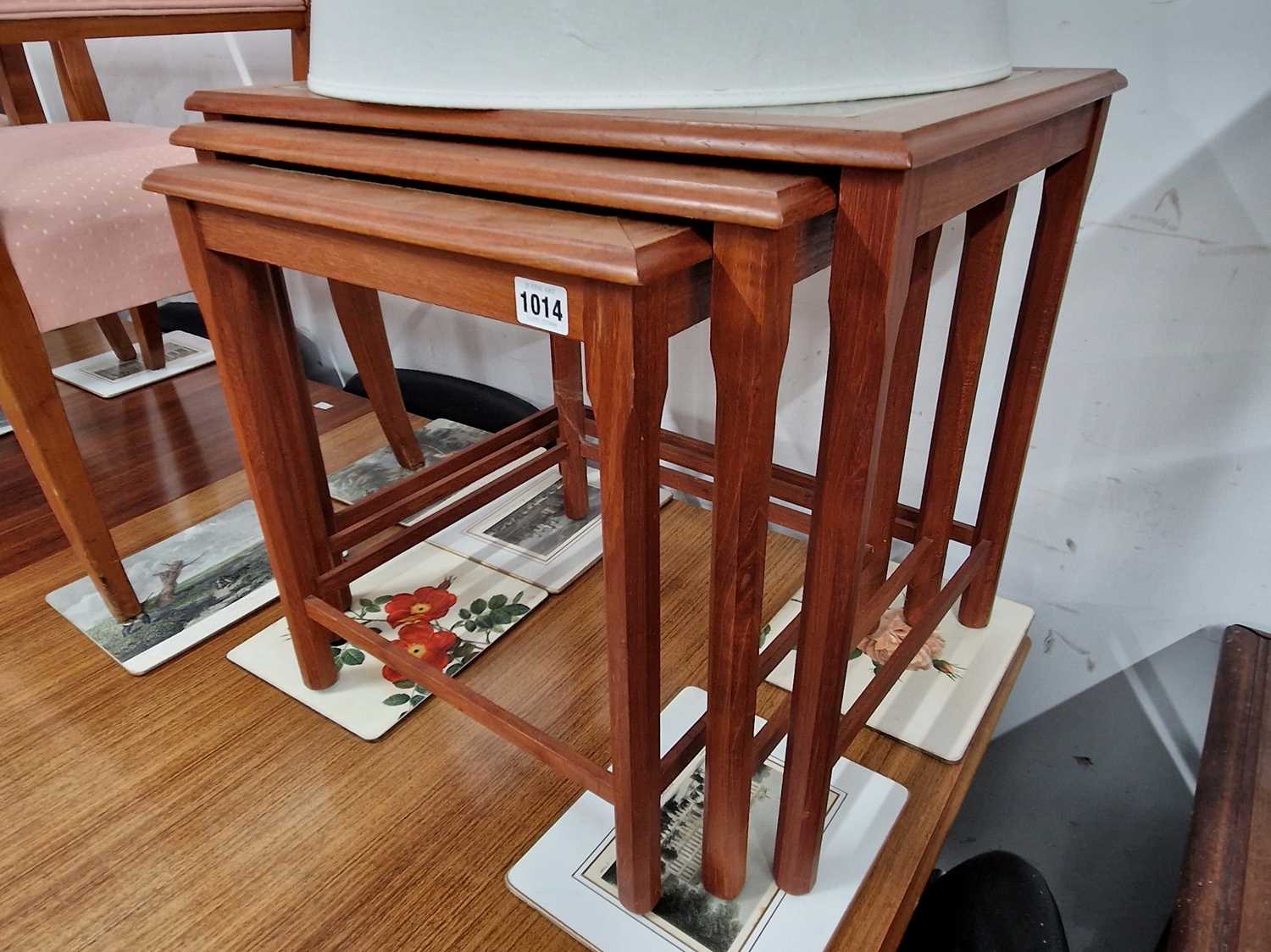 Lot 1014 - A retro nest of teak tile topped tables