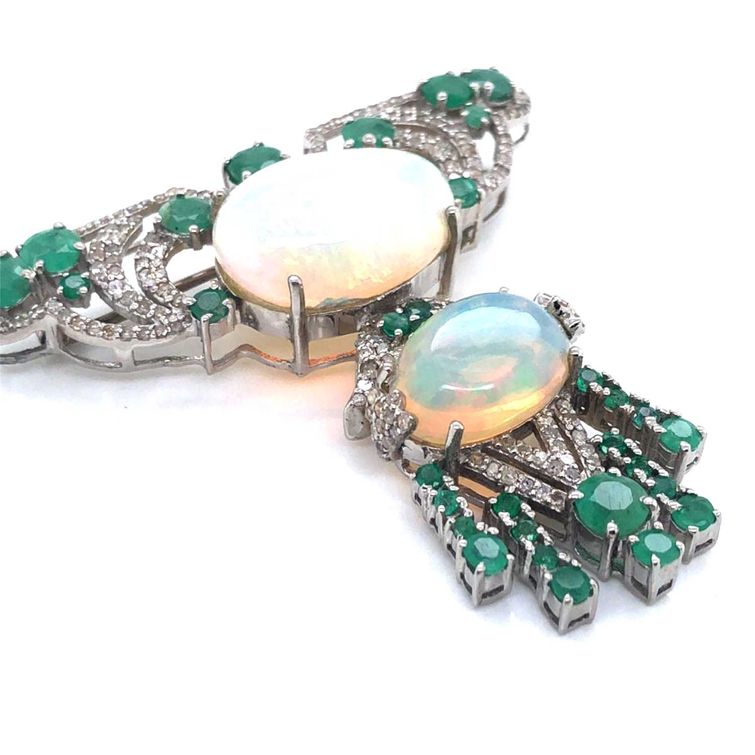 Lot 15 - An Art Nouveau-style opal, emerald and diamond...