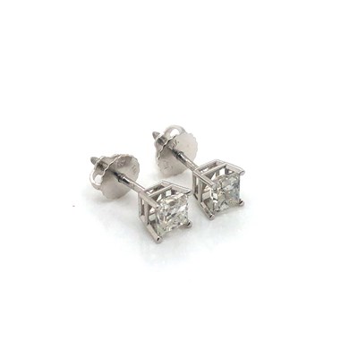 Lot 16 - A pair of princess-cut diamond stud earrings...