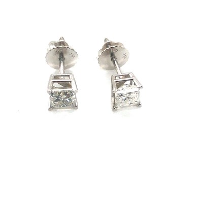 Lot 16 - A pair of princess-cut diamond stud earrings...