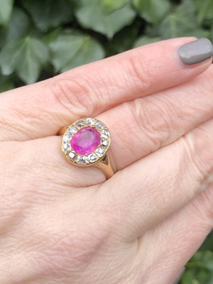 Lot 26 - An antique ruby and old cut diamond cluster...