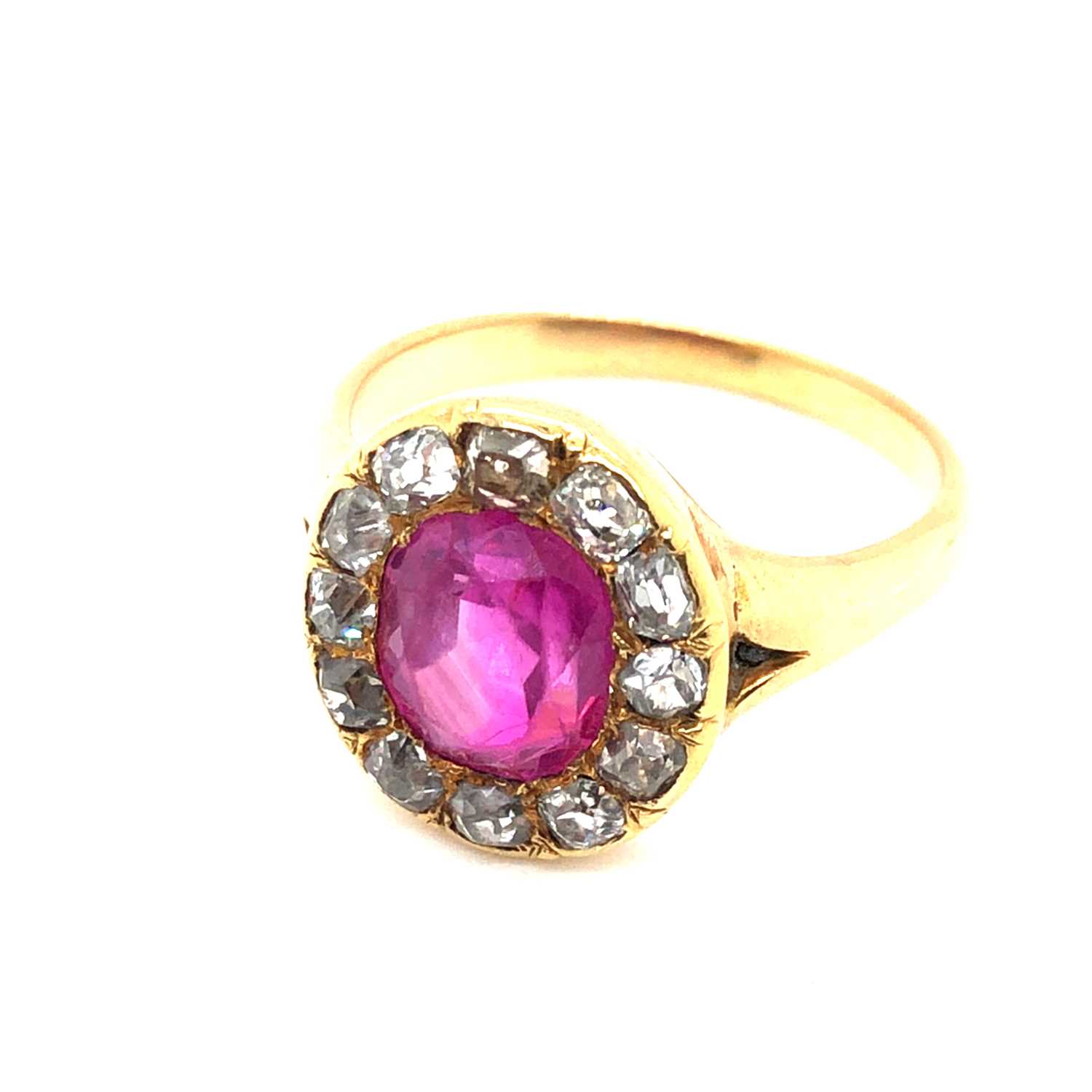 Lot 26 - An antique ruby and old cut diamond cluster...