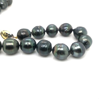 Lot 28 - A Tahitian graduated pearl necklace complete...