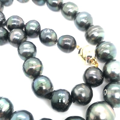 Lot 28 - A Tahitian graduated pearl necklace complete...