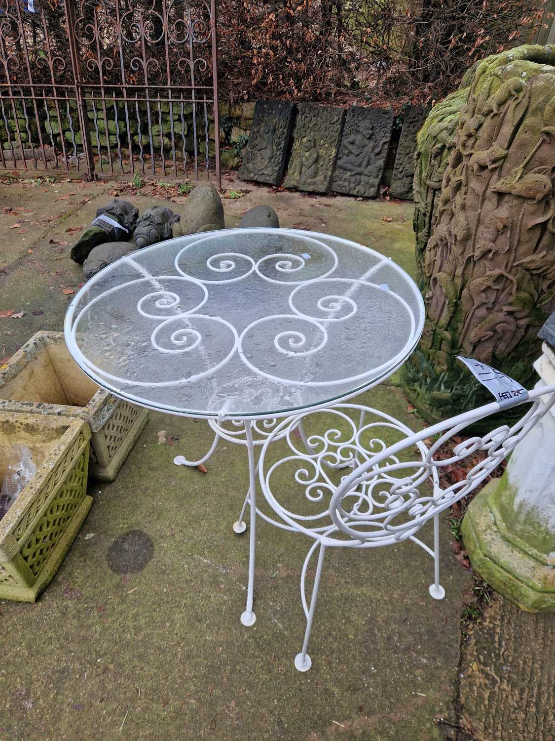 Lot 711 - A wire work wrought iron glass-topped patio...