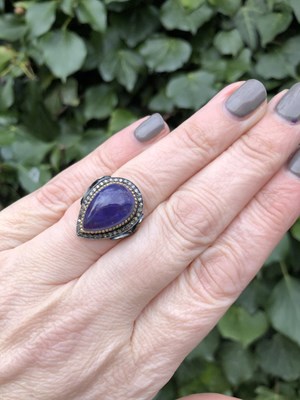 Lot 35 - A pear-shaped cabochon tanzanite and diamond...