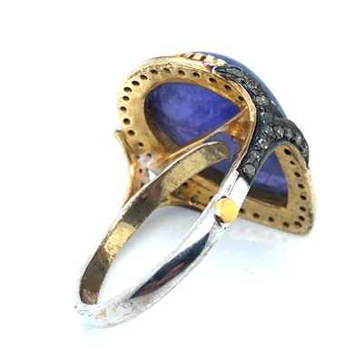 Lot 35 - A pear-shaped cabochon tanzanite and diamond...