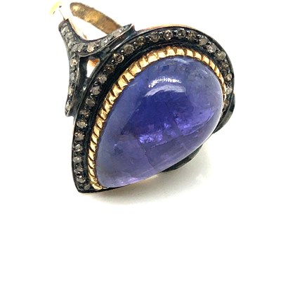 Lot 35 - A pear-shaped cabochon tanzanite and diamond...