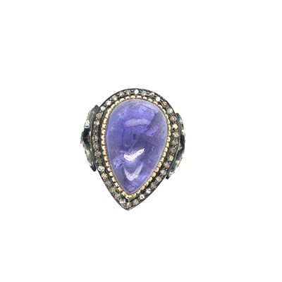 Lot 35 - A pear-shaped cabochon tanzanite and diamond...
