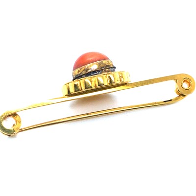 Lot 37 - An antique coral cabochon set bar brooch....