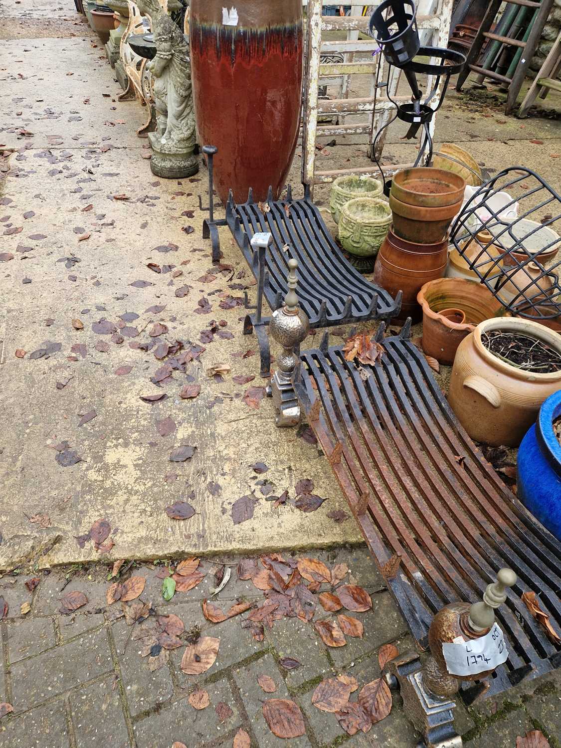 Lot 740 - Two large wrought iron fire grates and fire dogs.
