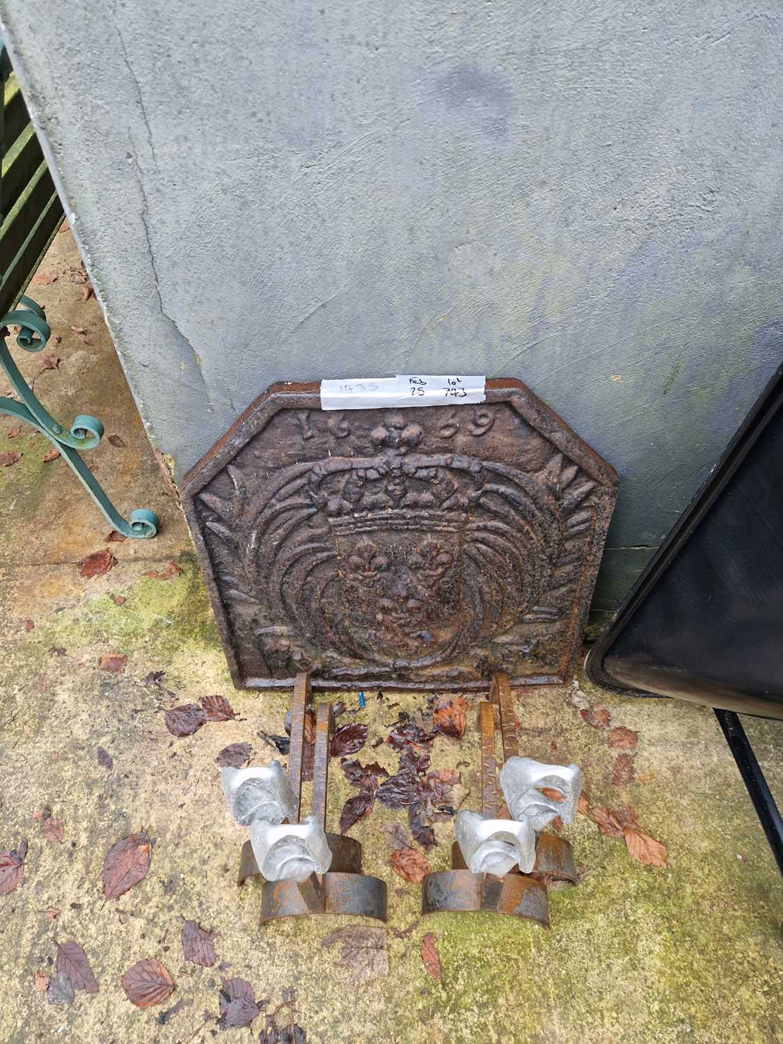 Lot 743 - A cast iron fire back. H 60 W 58 D4 cm