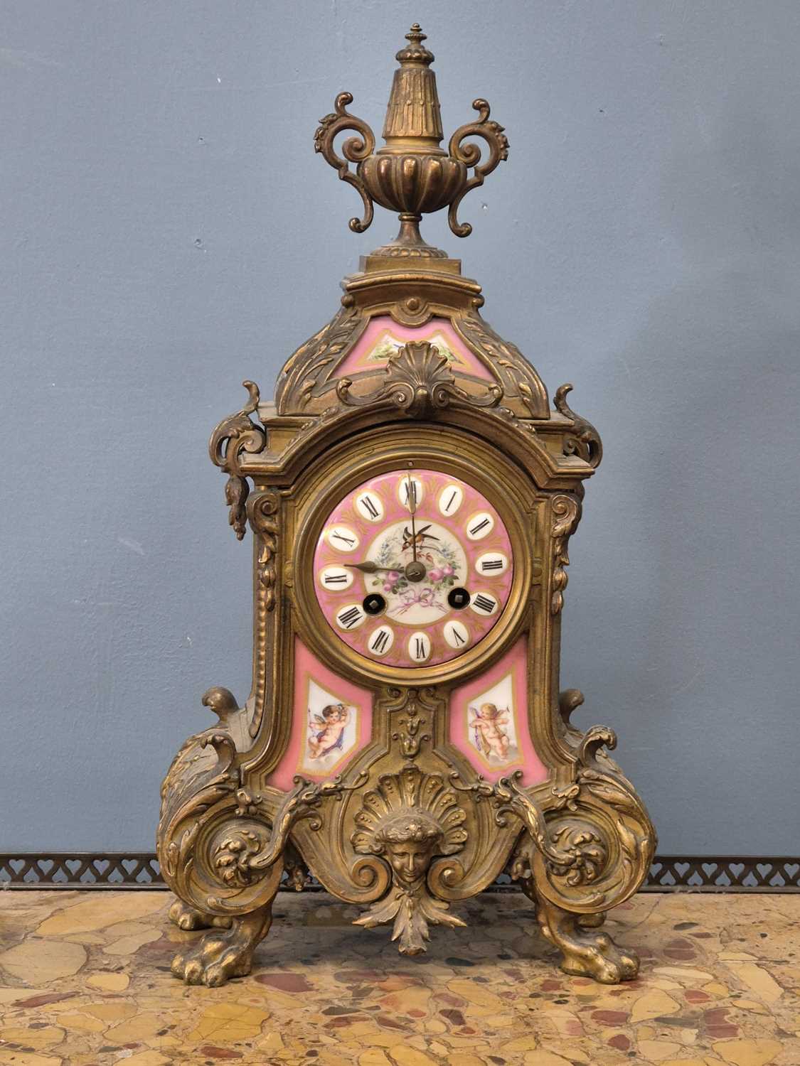 Lot 654 - A Victorian gilt brass Mantle clock with Inset...