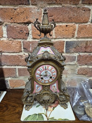 Lot 654 - A Victorian gilt brass Mantle clock with Inset...