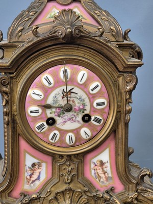 Lot 654 - A Victorian gilt brass Mantle clock with Inset...