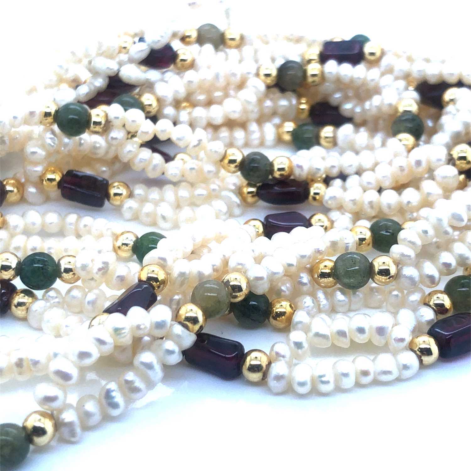 Lot 108 - A pearl and stone set double row necklace...