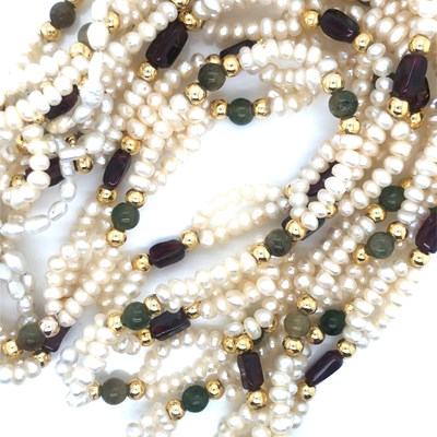 Lot 108 - A pearl and stone set double row necklace...