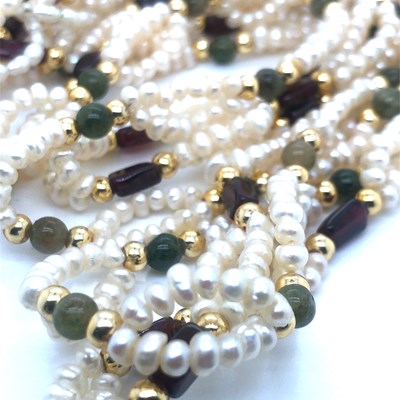 Lot 108 - A pearl and stone set double row necklace...