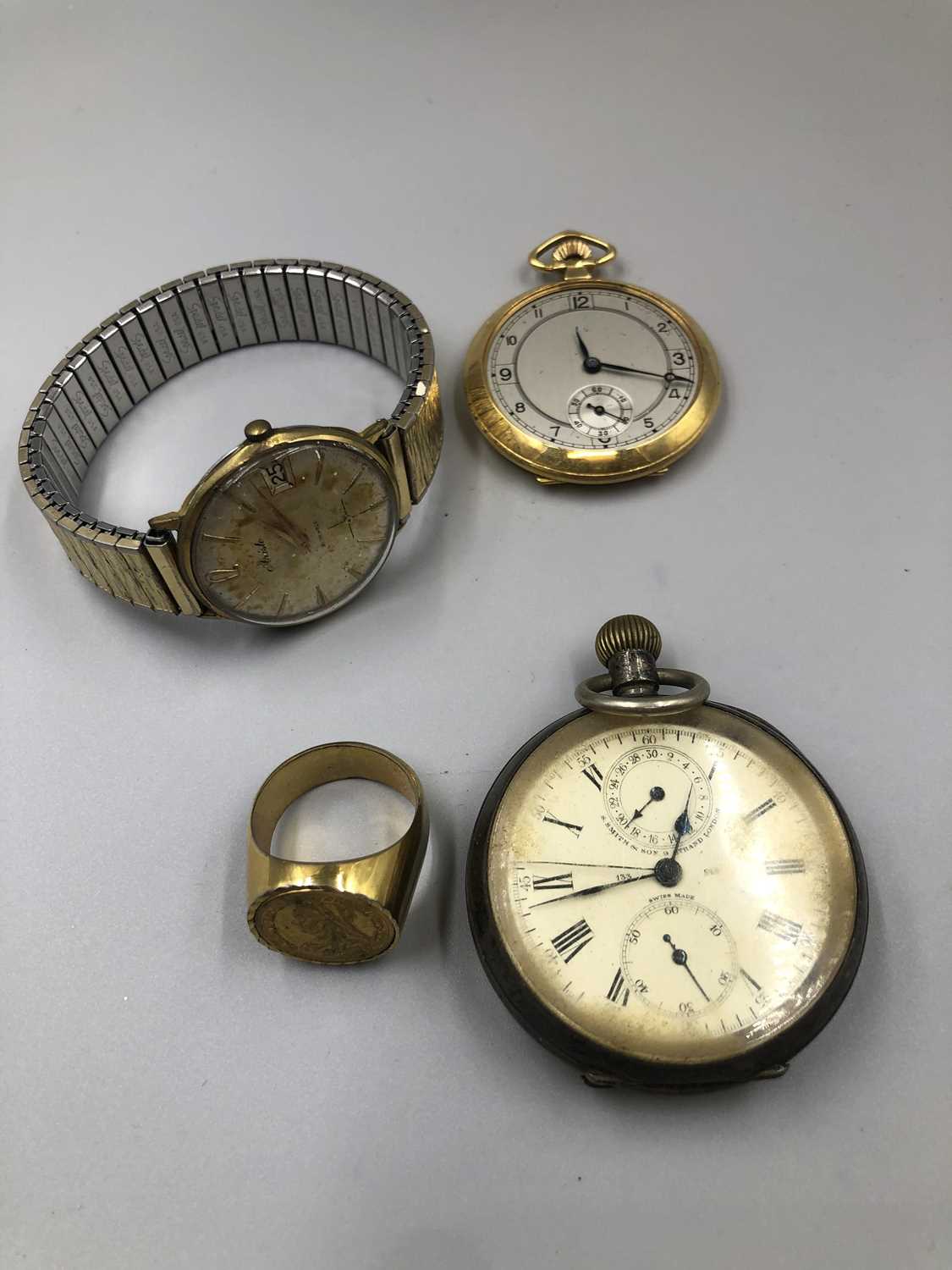 Lot 111 - A 935 Swiss silver pocket watch, a rolled gold...