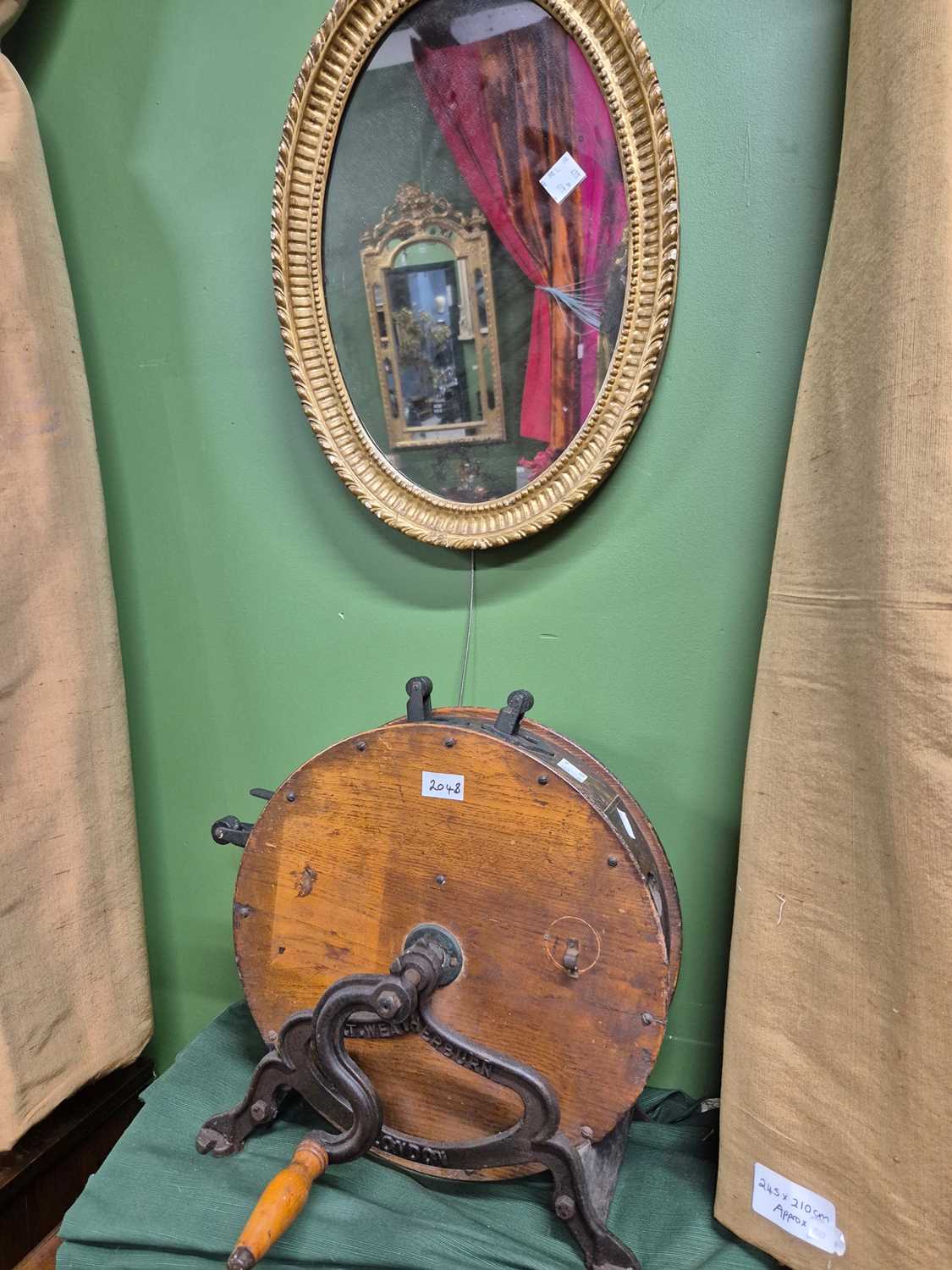 Lot 2048 - An urn topped gilt framed oval mirror, a...