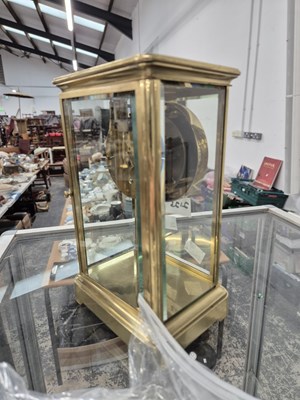 Lot 2125 - A glazed brass cased timepiece with a mercury...