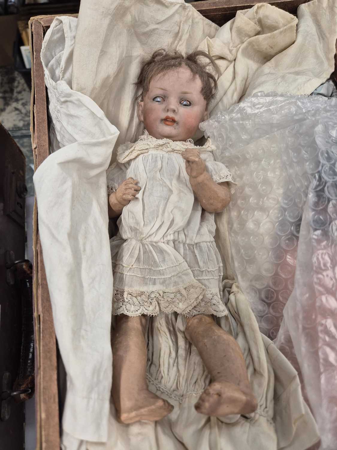 Lot 2144 - Three German bisque doll's heads with body...