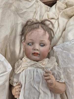 Lot 2144 - Three German bisque doll's heads with body...
