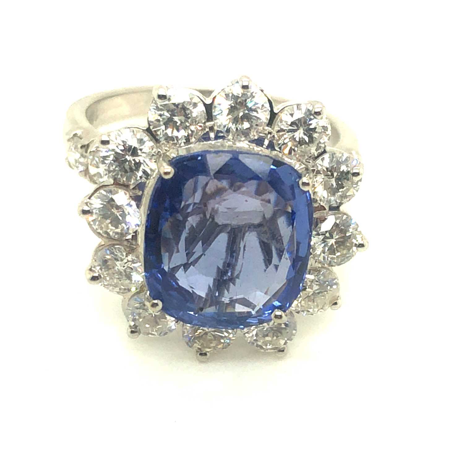 Lot 61 - A large sapphire and diamond cluster ring with...
