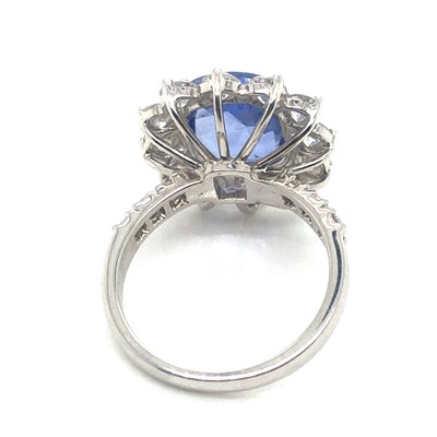 Lot 61 - A large sapphire and diamond cluster ring with...