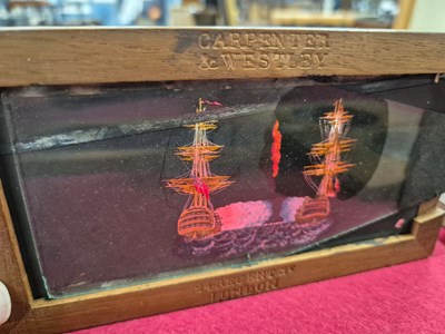 Lot 212 - A collection of antique hand-coloured magic...