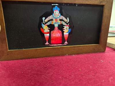 Lot 212 - A collection of antique hand-coloured magic...