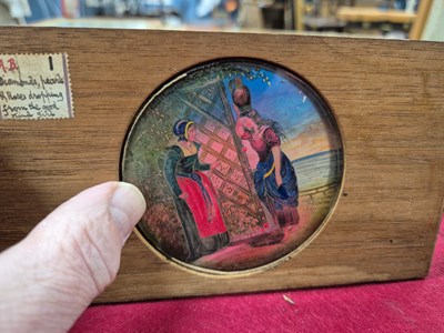 Lot 212 - A collection of antique hand-coloured magic...