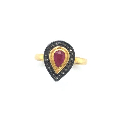 Lot 114 - A pear-shaped ring set with a pear-shaped ruby...
