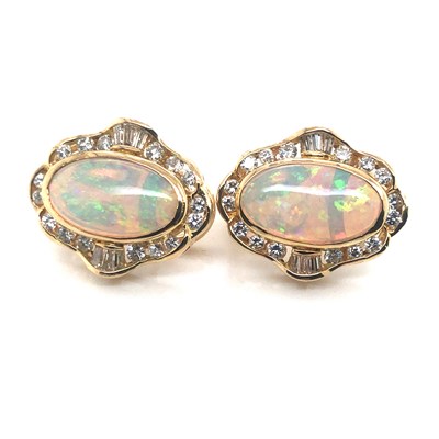 Lot 74 - A pair of opal and diamond large stud earrings...