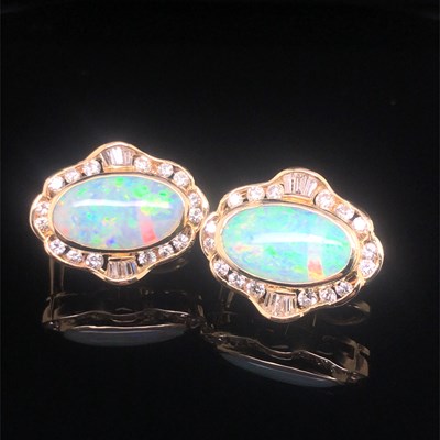 Lot 74 - A pair of opal and diamond large stud earrings...