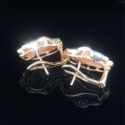 Lot 74 - A pair of opal and diamond large stud earrings...