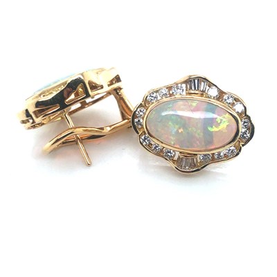 Lot 74 - A pair of opal and diamond large stud earrings...