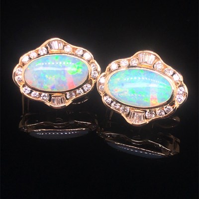 Lot 74 - A pair of opal and diamond large stud earrings...