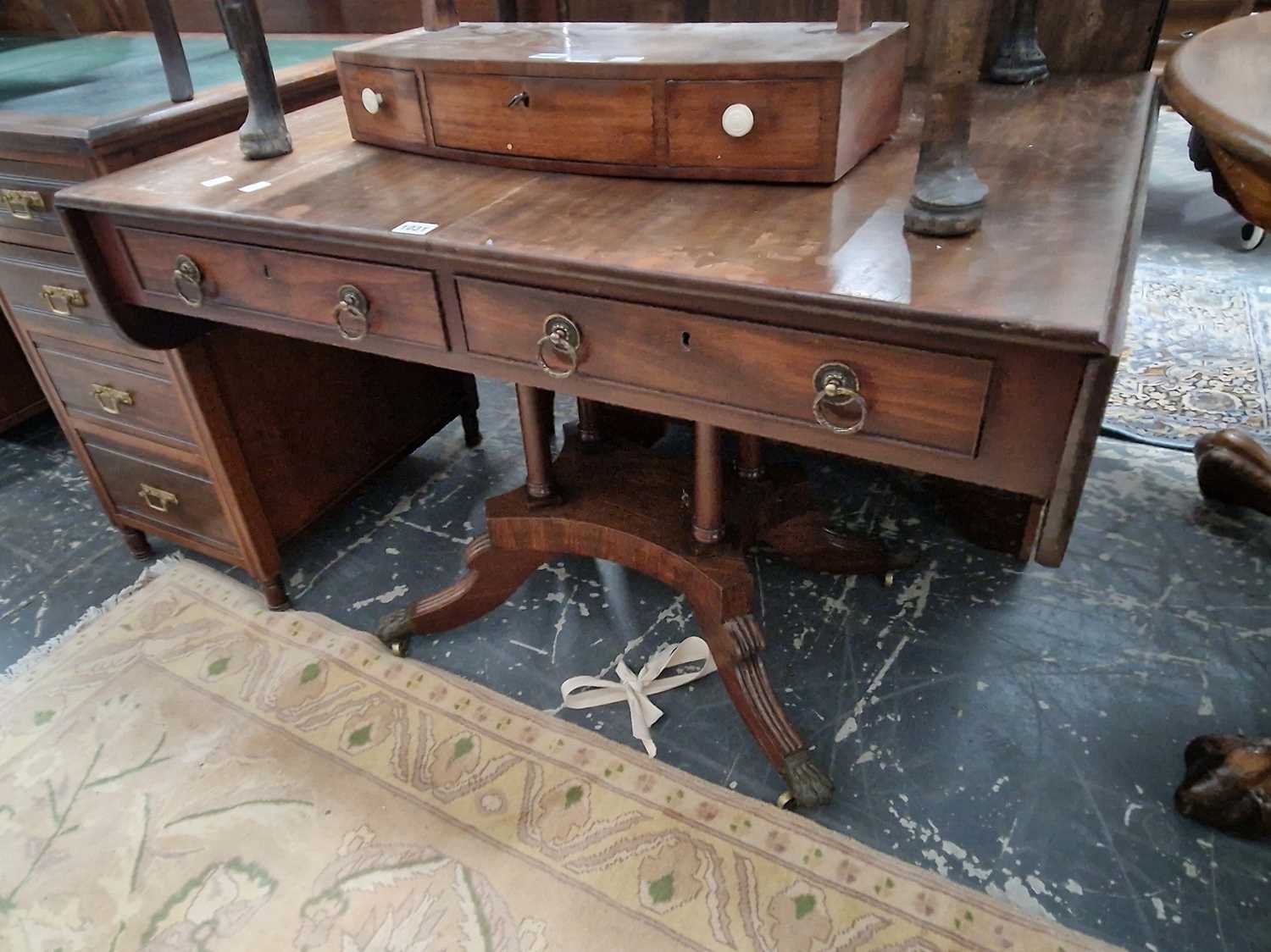 Lot 1031 - A George III mahogany sofa table with two...
