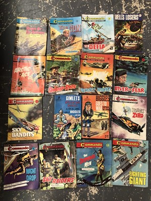 Lot 1038 - A small vintage suitcase containing Commando...