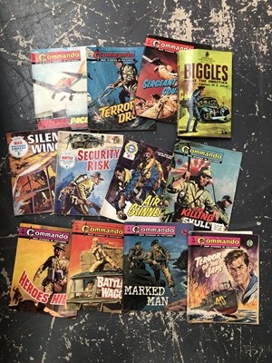 Lot 1038 - A small vintage suitcase containing Commando...