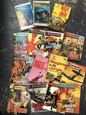 Lot 1038 - A small vintage suitcase containing Commando...