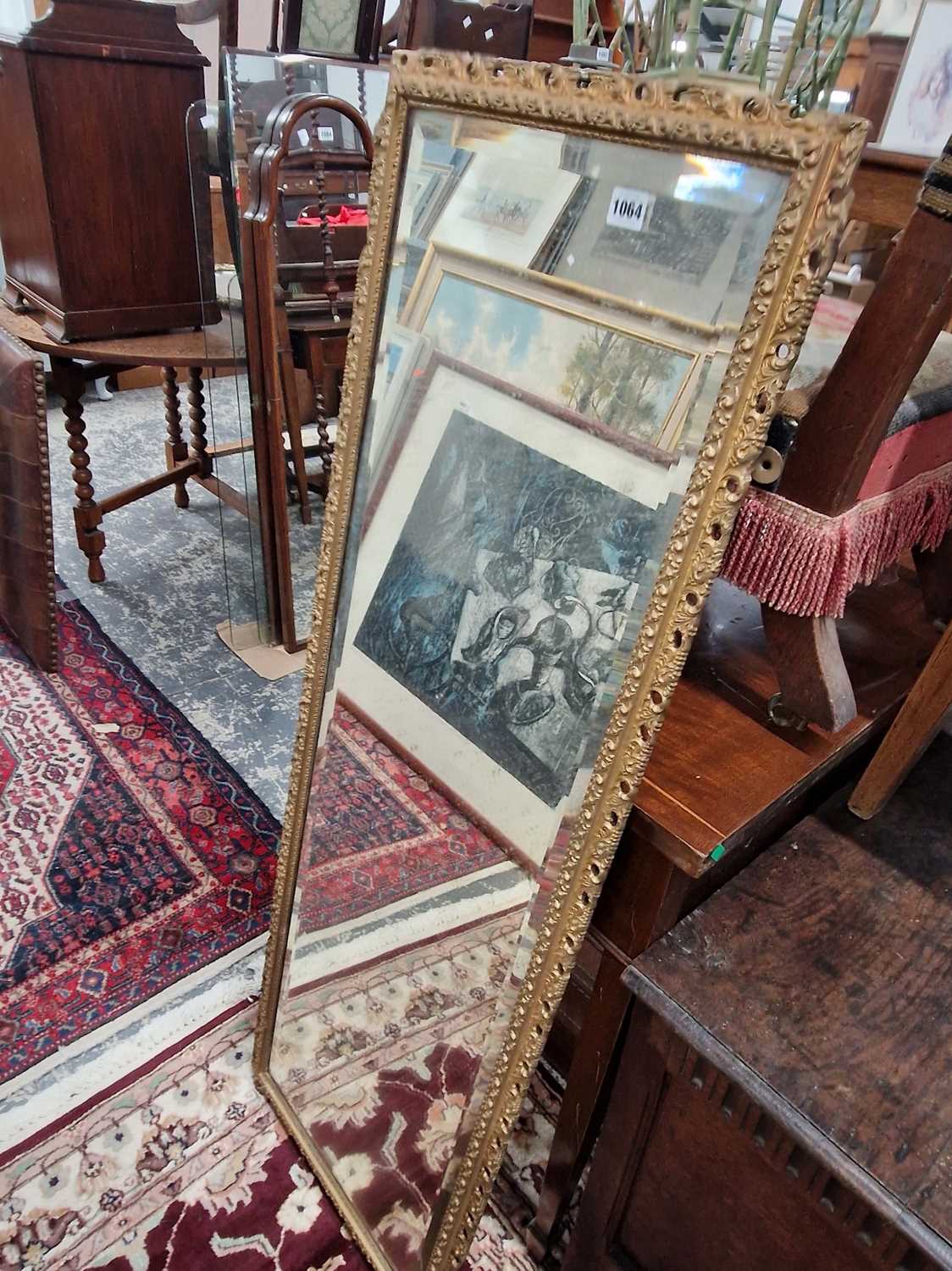 Lot 1064 - A gilt framed long mirror