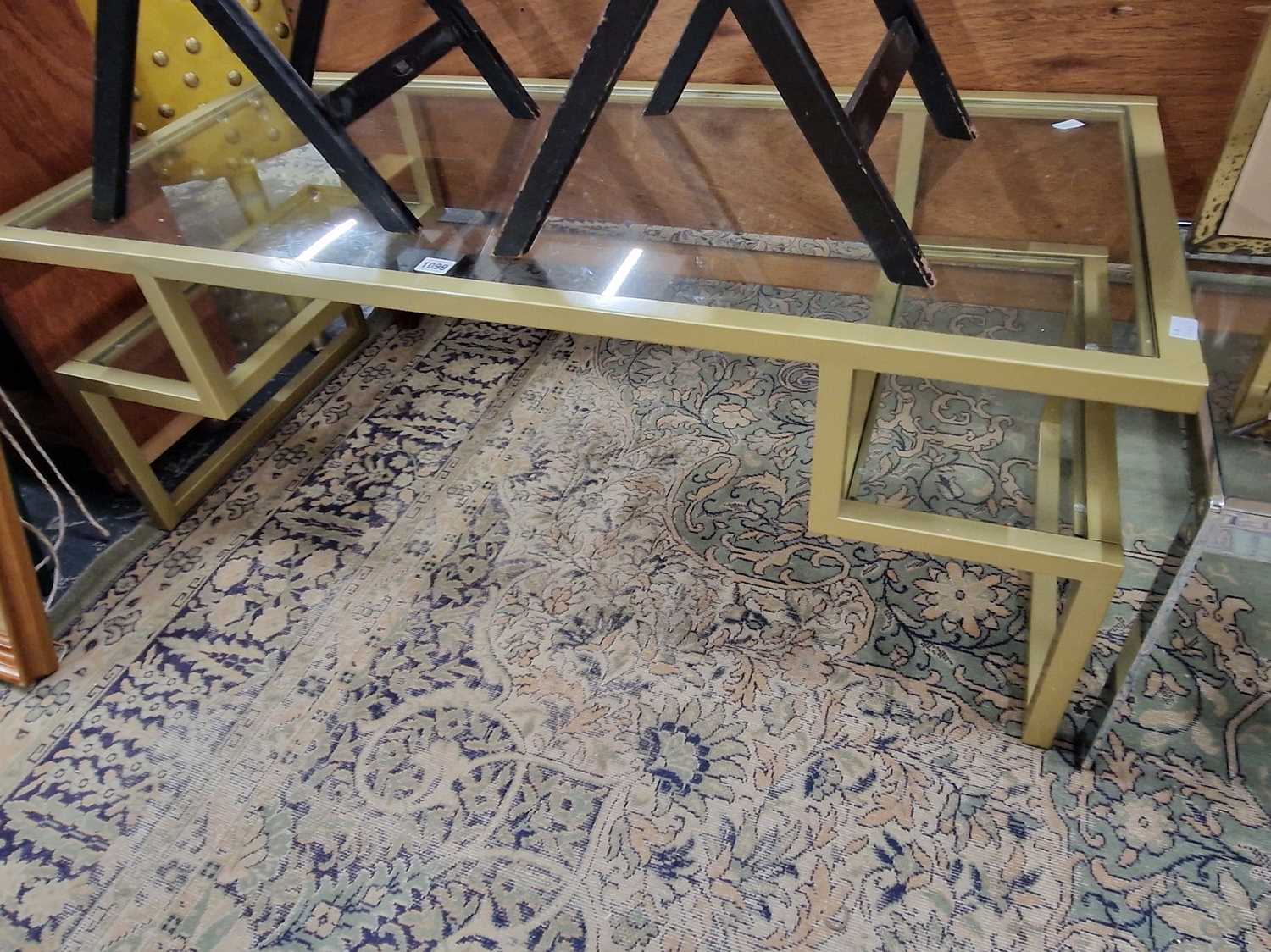 Lot 1099 - A retro glass topped coffee table.