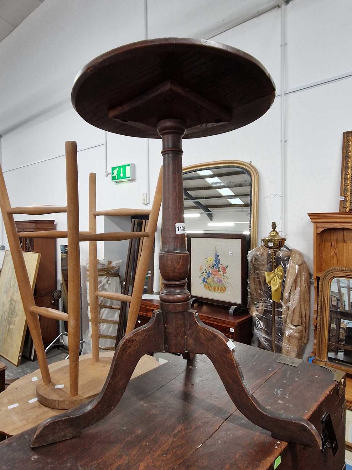 Lot 1139 - A small Georgian country oak tripod table.