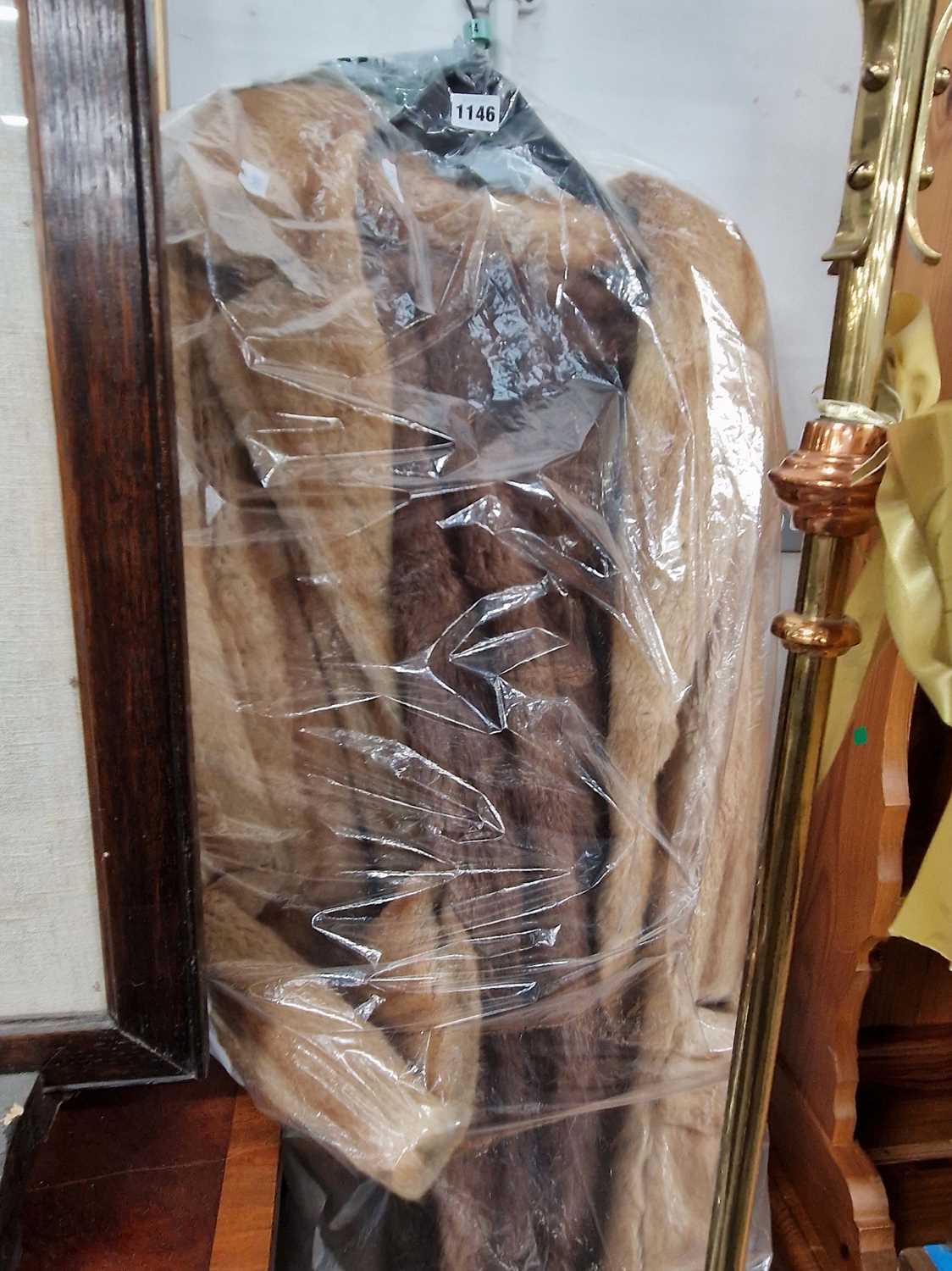 Lot 1146 - A fur jacket and two mink fur shoulder capes.
