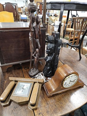 Lot 1183 - Two carved hardwood african figures together...